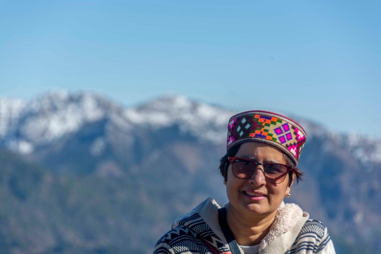 Monika Rana wearing a colourful Himachali cap